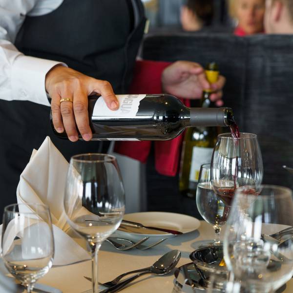 Wine being served to Ultramarine guests in the Balena Restaurant