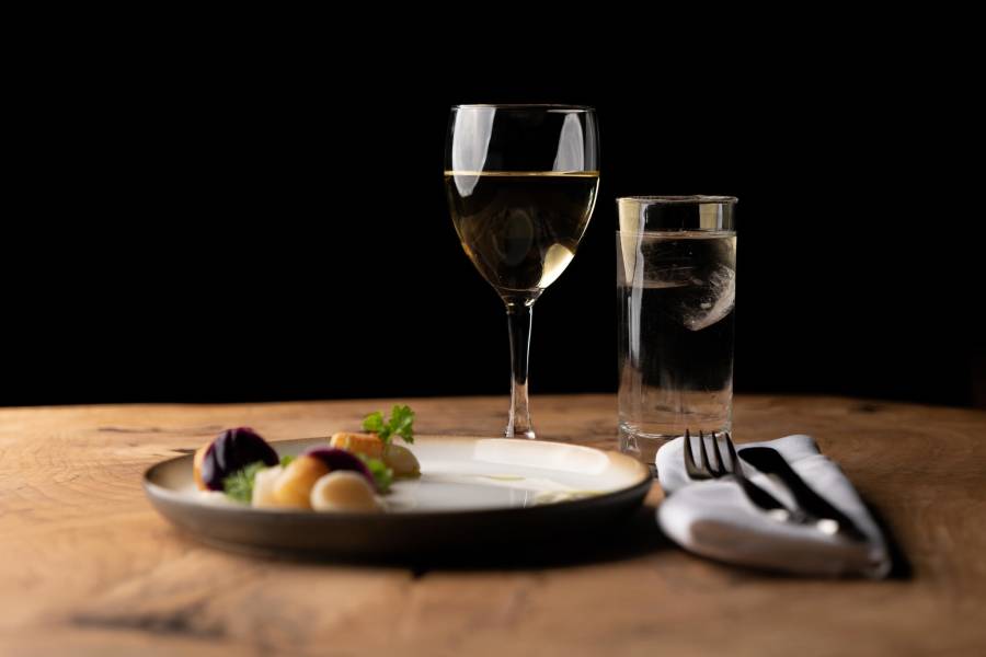 Seared and pickled clams served with turnip purée, butter-steamed red kale with herbs and herb oil