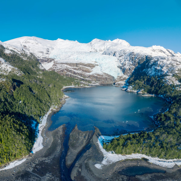 Snow capped mountains with a valley lake in Patagonia