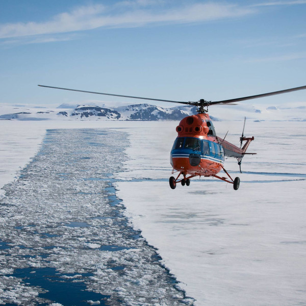 Helicopter in Arctic landscape
