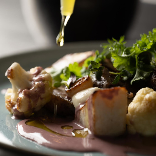 Baked lamb, cauliflower purée, turnip Parisienne, fried cauliflower and beurre rouge served with salt-baked Greenlandic potatoes