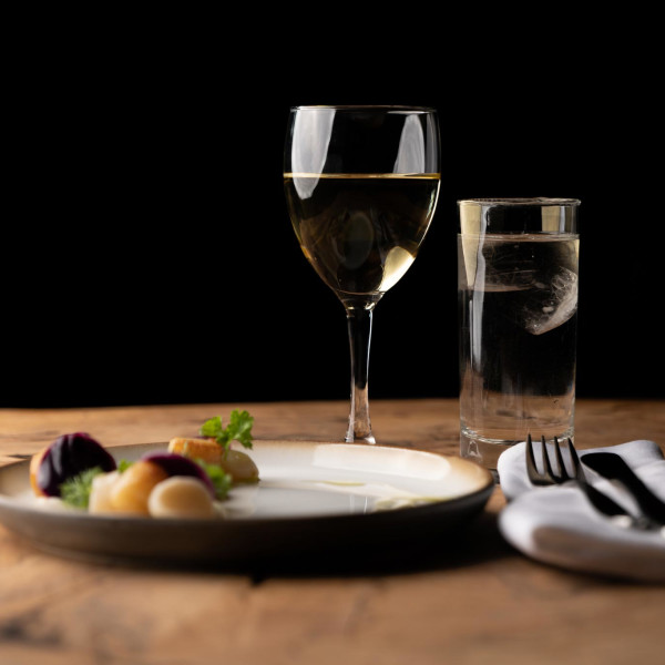 Seared and pickled clams served with turnip purée, butter-steamed red kale with herbs and herb oil