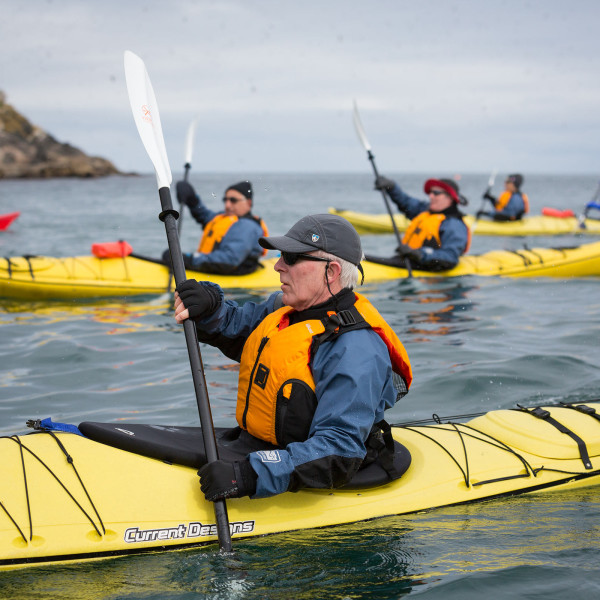 Passengers kayaking near the Norwegian Coast